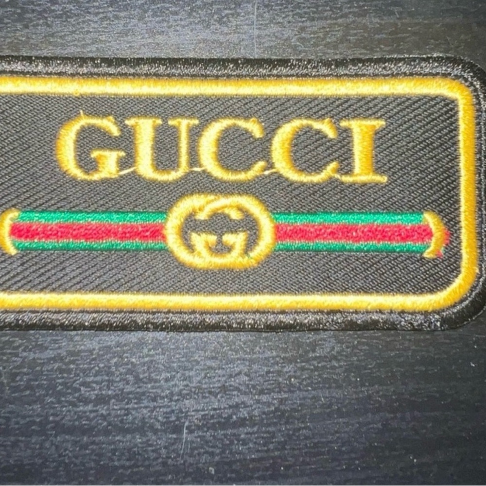 Gucci Black and Gold Logo Patch